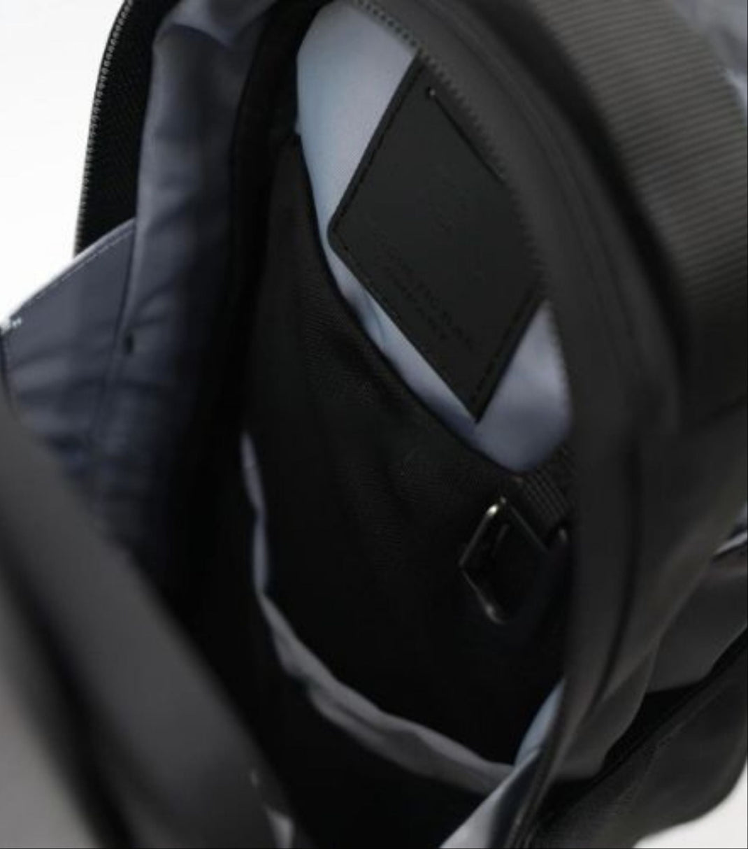 Open Bag with Items Inside:
"Spacious Evania Magnetic Gym Bag showing compartments for shoes and clothes"